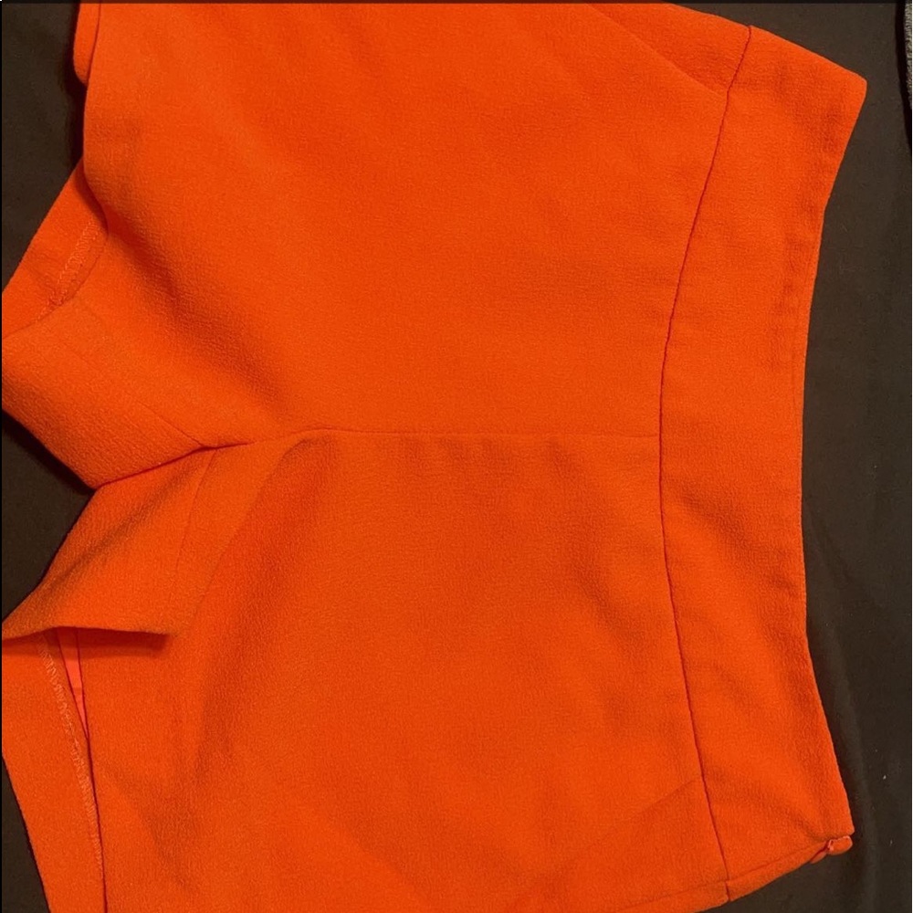 Orange shorts with zipper
